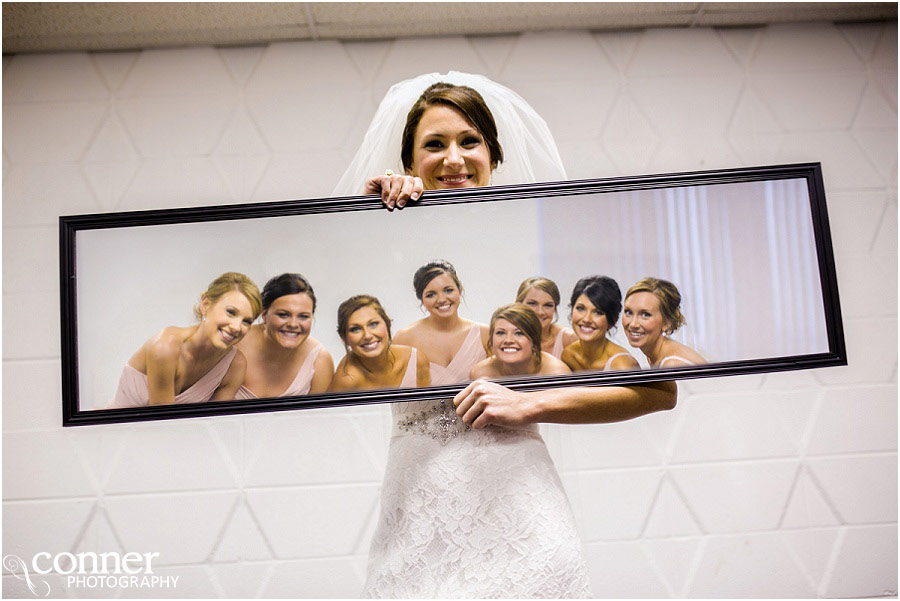bride and bridesmaids in mirror