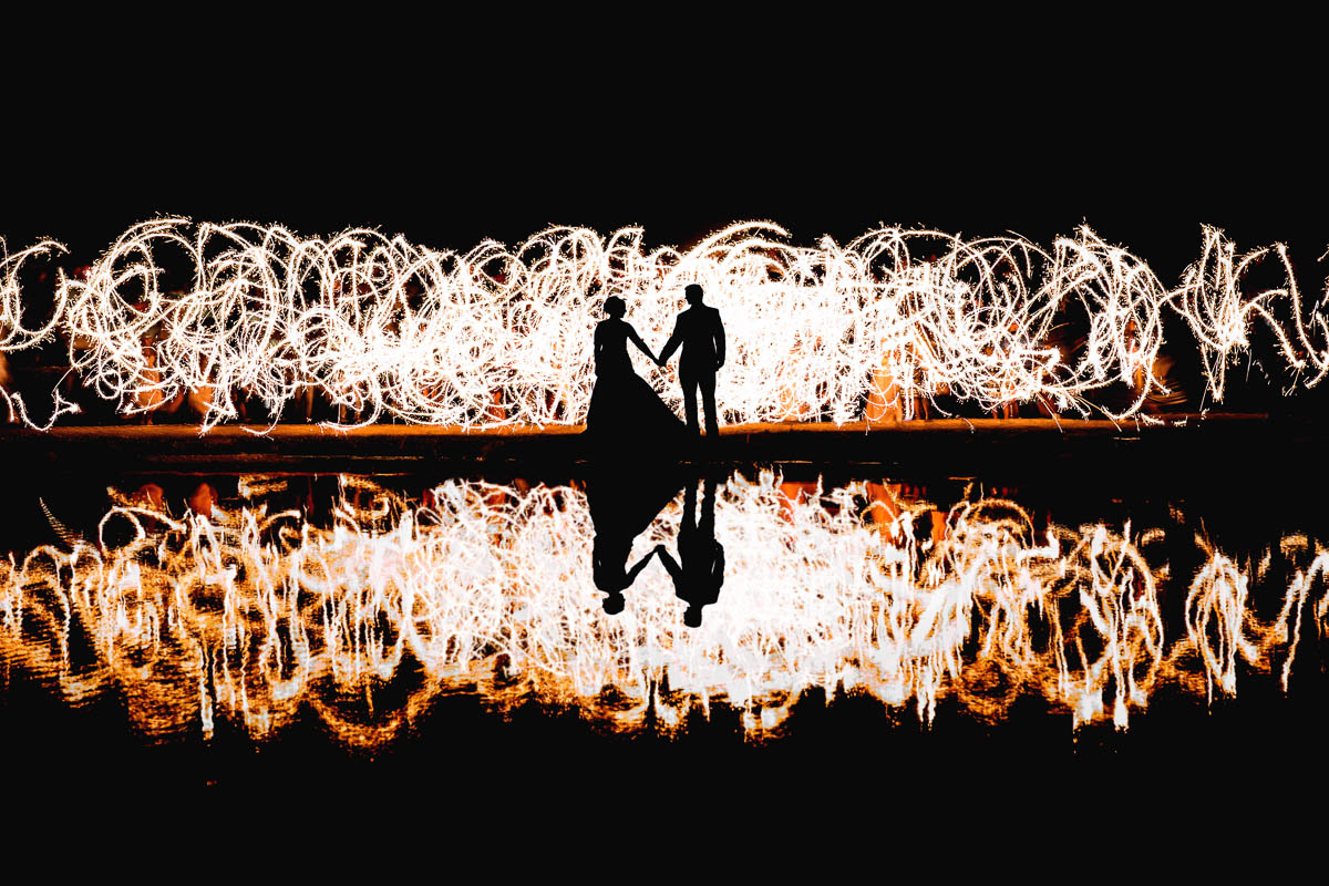 bride and groom lit with sparklers in st louis, mo