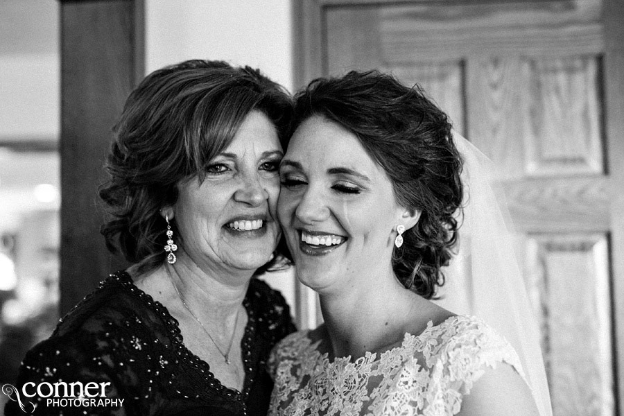 bride and mother crying