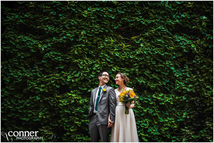 bride groom ivy wall