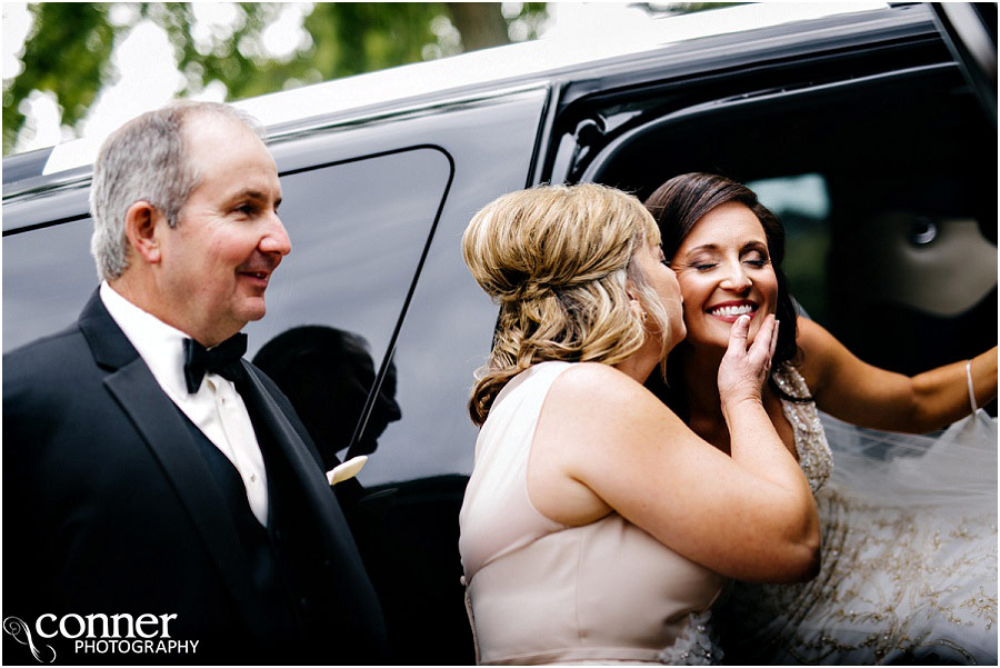 mother kissing bride