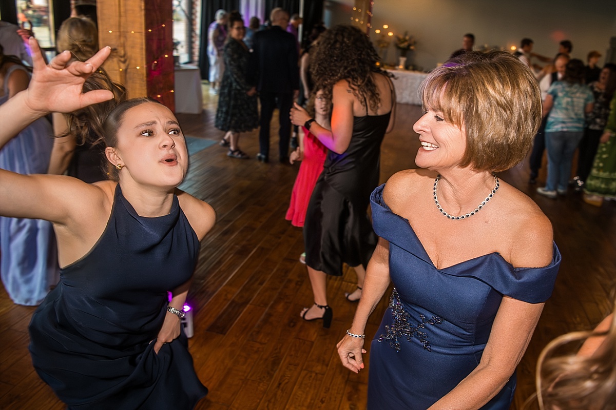 Wedding guests dance and laugh during the DuBourg Centre reception