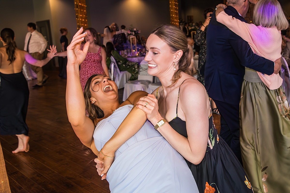 Wedding guests dance and laugh during the DuBourg Centre reception
