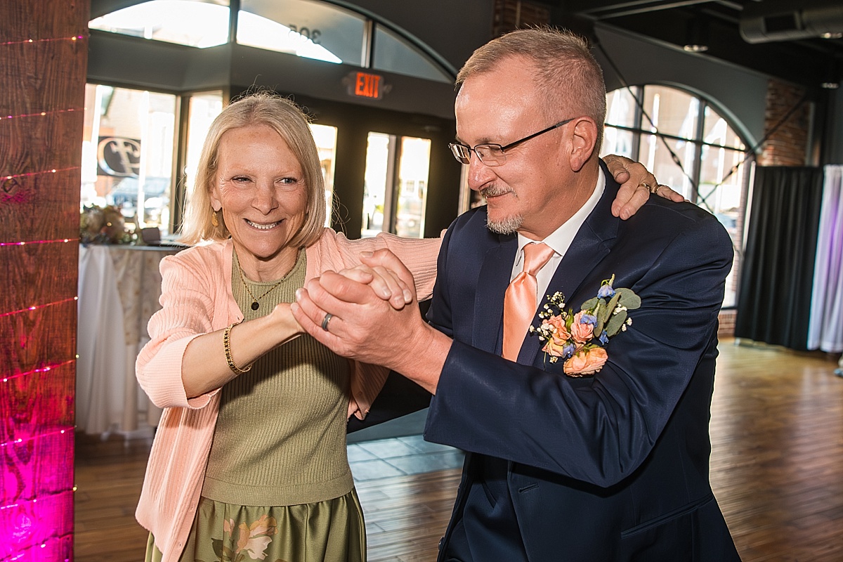 Wedding guests dance and laugh during the DuBourg Centre reception