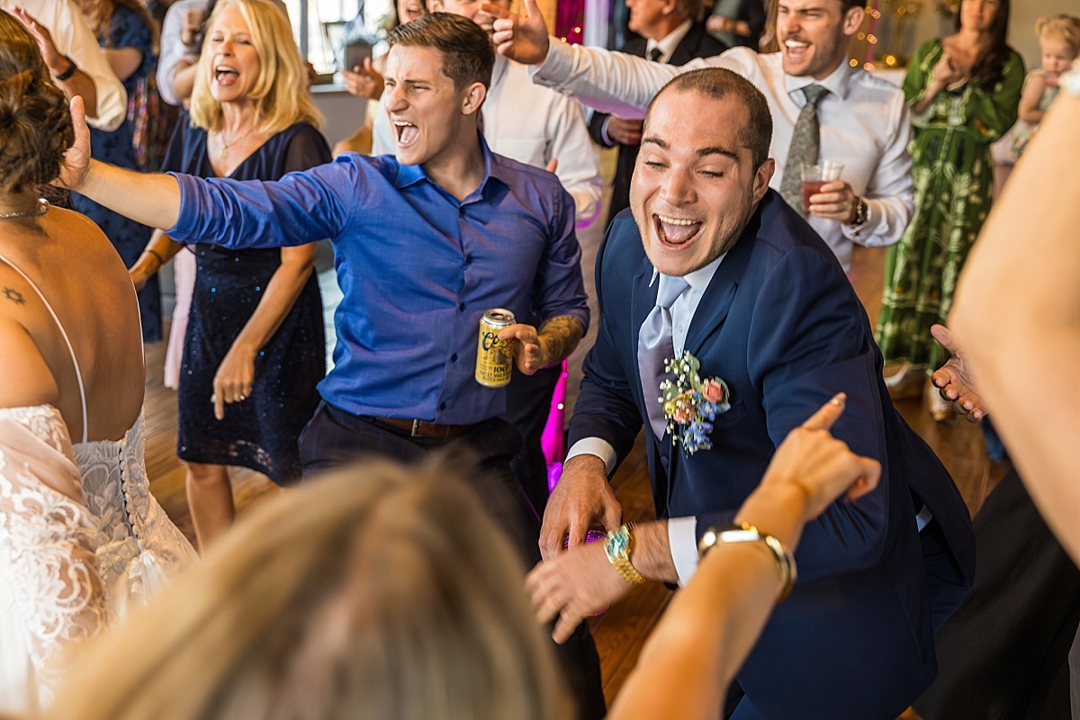 Wedding guests dance and laugh during the DuBourg Centre reception