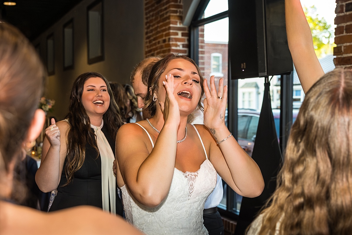 Wedding guests dance and laugh during the DuBourg Centre reception