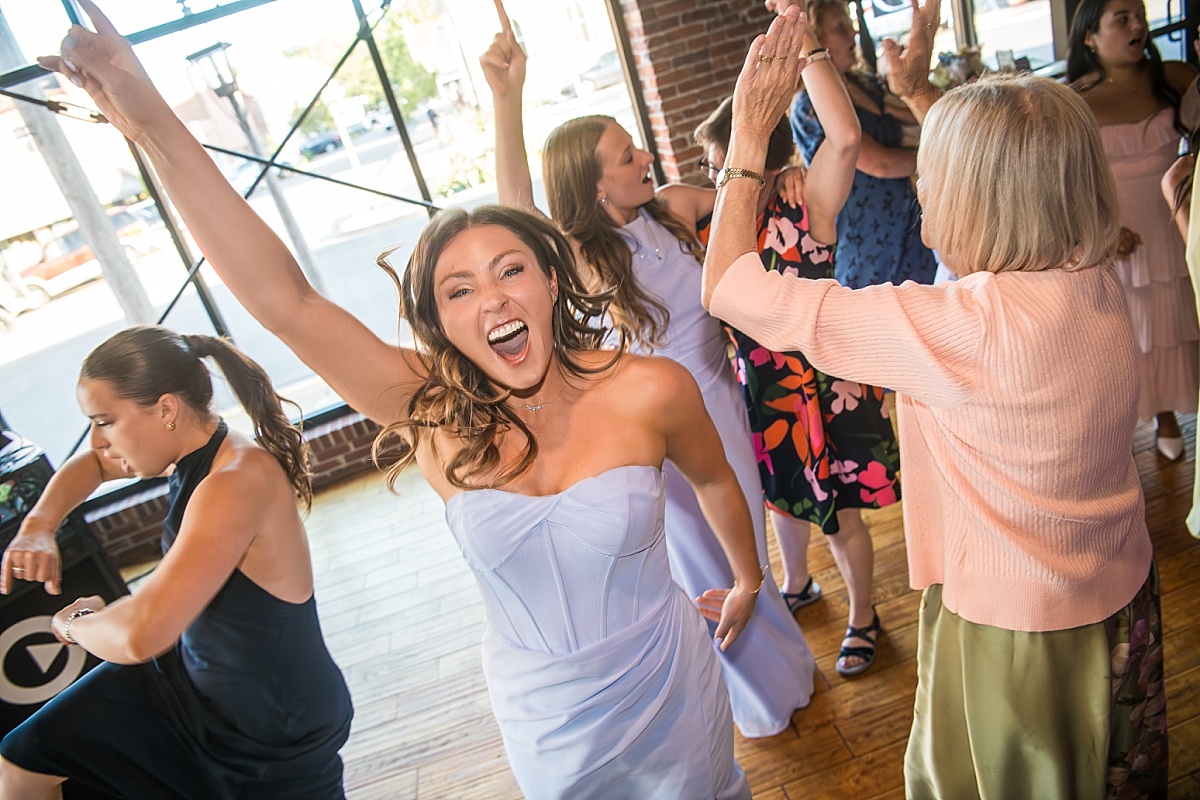 Wedding guests dance and laugh during the DuBourg Centre reception