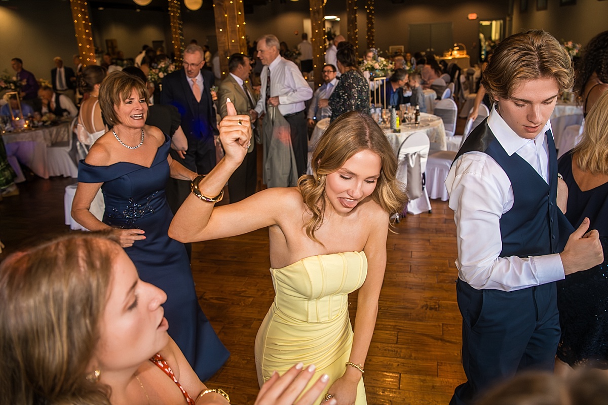 Wedding guests dance and laugh during the DuBourg Centre reception