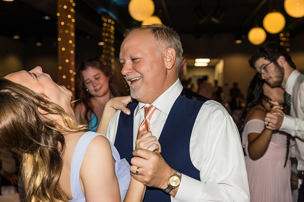 Wedding guests dance and laugh during the DuBourg Centre reception