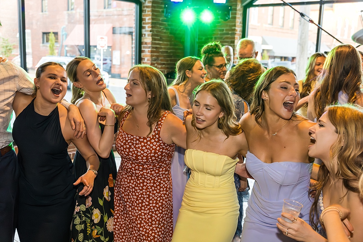 Wedding guests dance and laugh during the DuBourg Centre reception