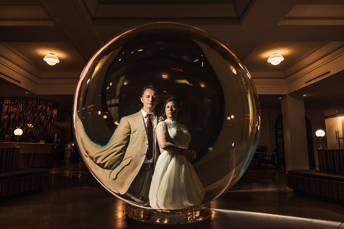 21c Hotel Bride and Groom Portrait with the gallery artwork