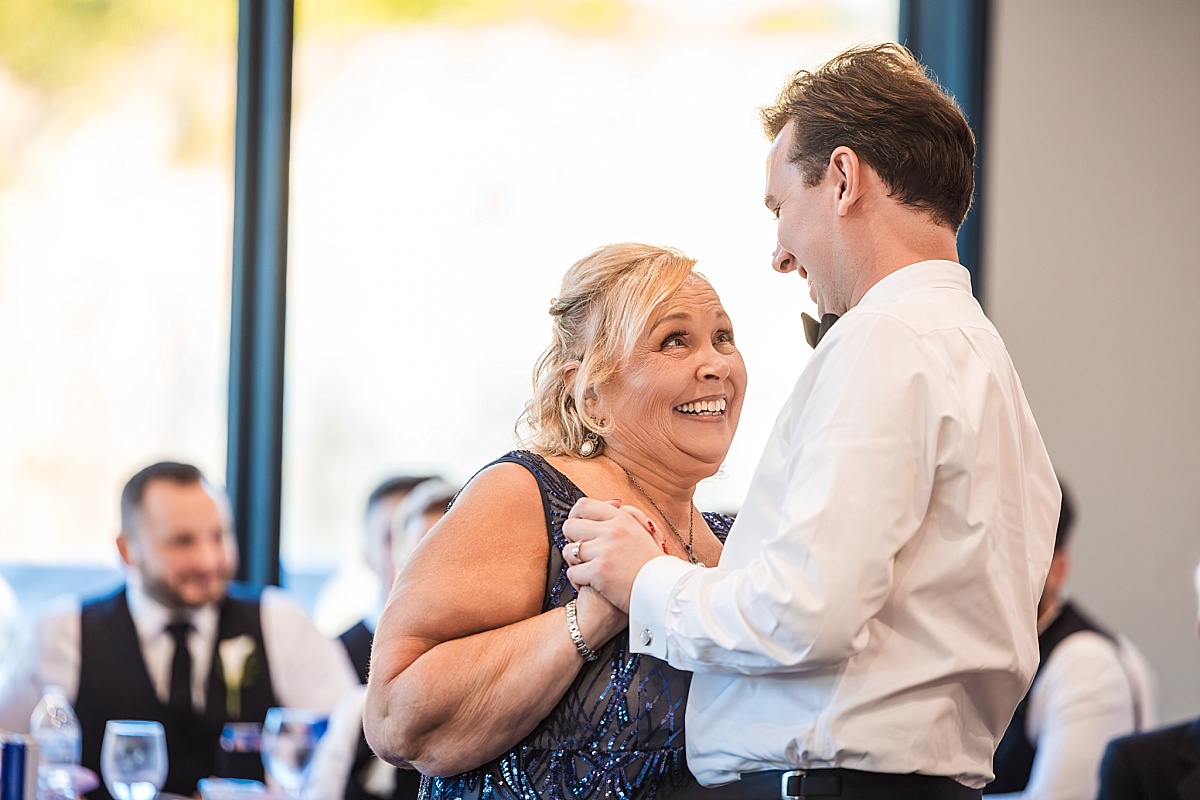 Justin shares an emotional, joyful dance with his mother during the wedding reception.