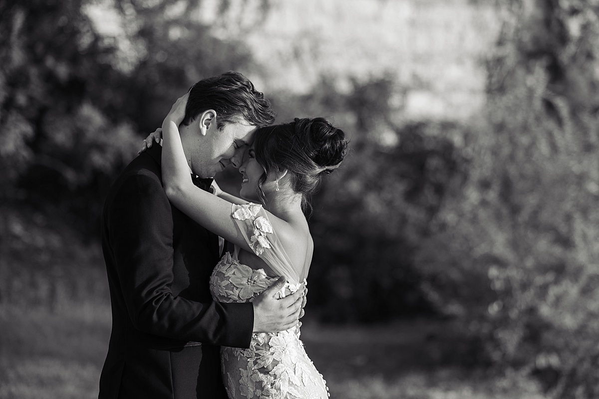 Melicia and Justin share a romantic wedding portrait at Sunset Bluffs.