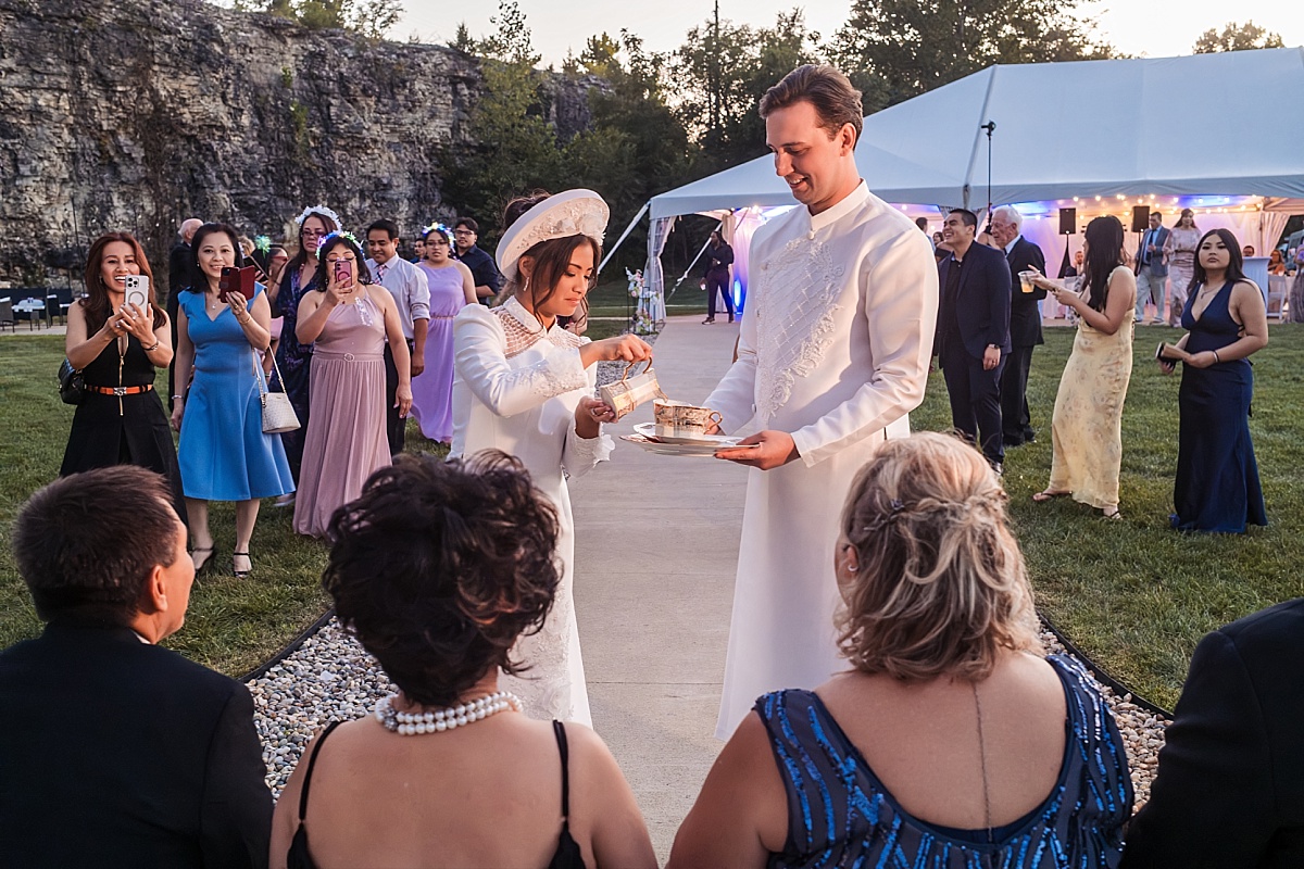 Melicia and Justin wear traditional Vietnamese wedding attire during their tea ceremony honoring their parents.