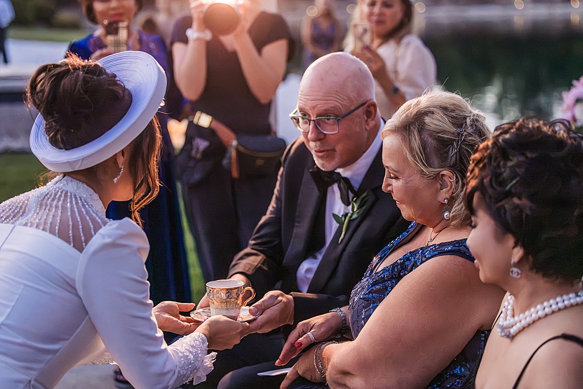 Melicia serves tea to her parents during the traditional Vietnamese wedding tea ceremony.